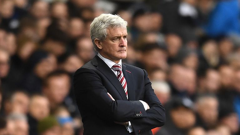 Mark Hughes stands on the sidelines with his team 4-0 down