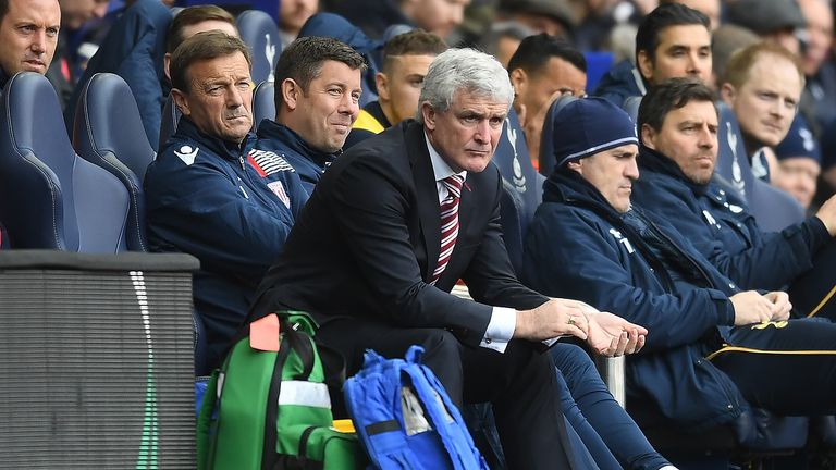 Mark Hughes watches as his Stoke City side are beaten 4-0 at White Hart Lane