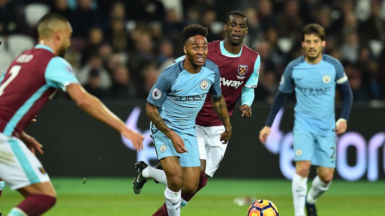 Manchester City's English midfielder Raheem Sterling (C) runs with the ball during the English Premier League football match between West Ham United and Ma