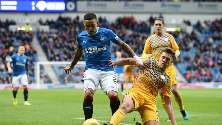James Tavernier is tackled by Mark Russell