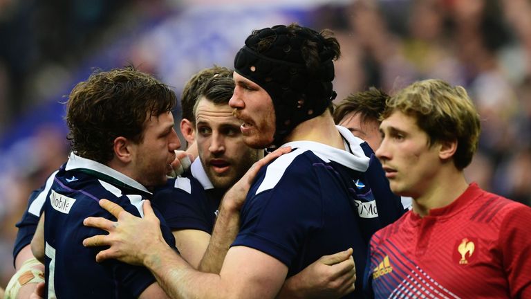 Tim Swinson (second right) celebrates after scoring a try 