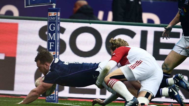 Scotland's full-back Stuart Hogg (1st-L) scores a try during the Six Nations international rugby union match between France and Scotland at the Stade de Fr