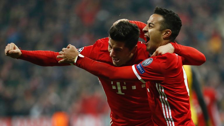 Robert Lewandowski and Thiago Alcantara (R) celebrate as Bayern go 3-1 up against Arsenal