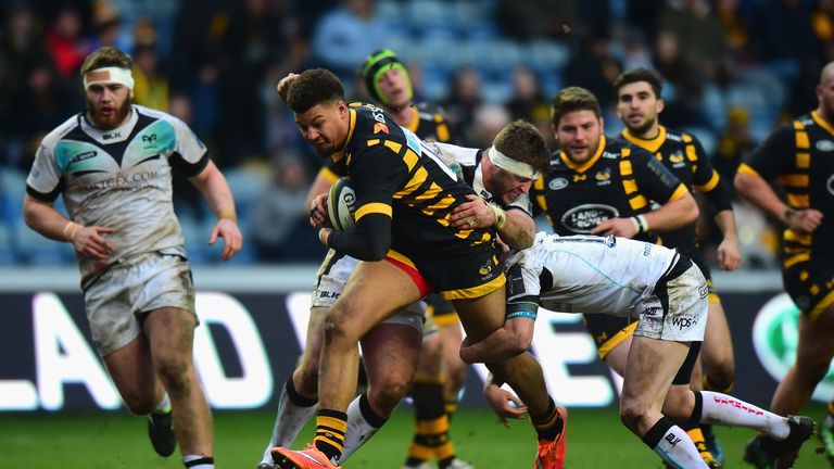 Guy Armitage is tackled by Rhodri Jones of the Ospreys