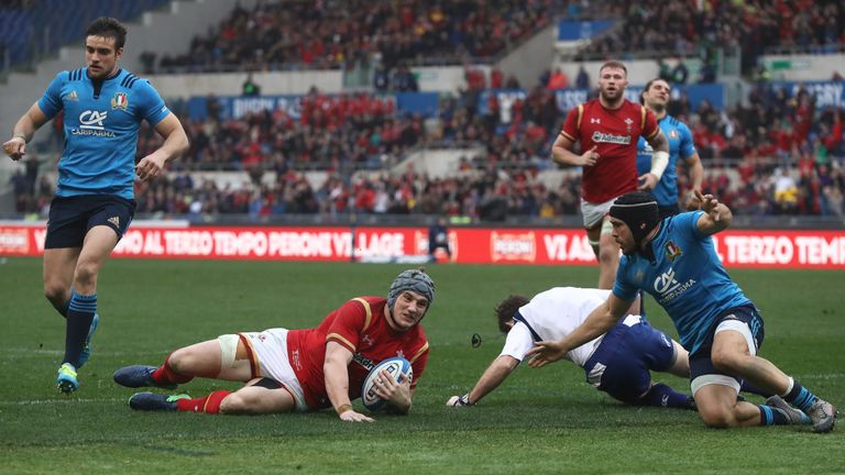 Jonathan Davies slides over to score Wales' first try against Italy
