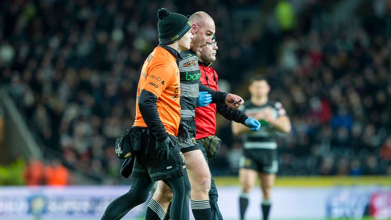 Gareth Ellis is helped from the field against Catalans