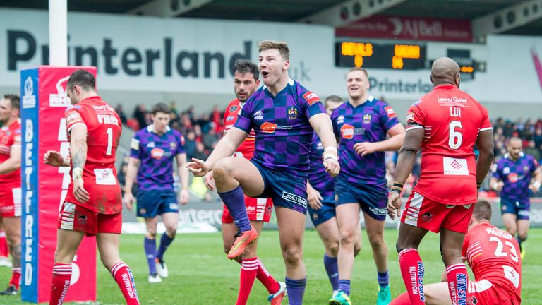 George Williams celebrates scoring a try against Salford