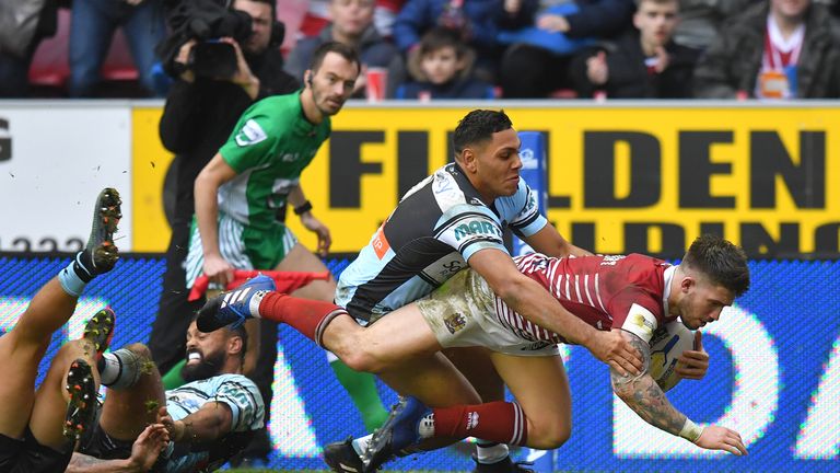 Oliver Gildart scores Wigan's try against Cronulla