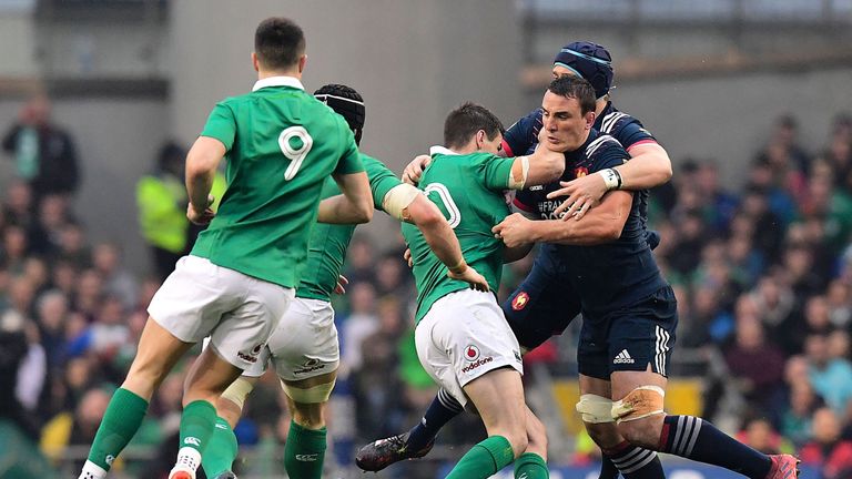 Louis Picamoles is tackled by Ireland fly-half Johnny Sexton