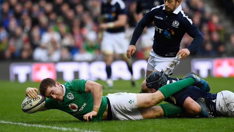Paddy Jackson dives over to score Ireland's third try against Scotland