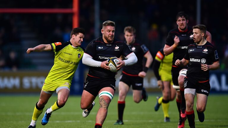 Richard Barrington makes a break past Freddie Burns of Leicester