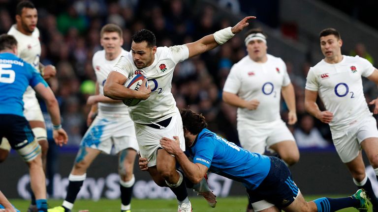 Ben Te'o is tackled by Italy's centre Luke McLean during the Six Nations match at Twickenham