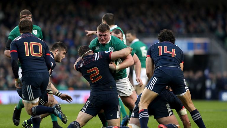 Tadhg Furlong is tackled by France's Guilhem Guirado