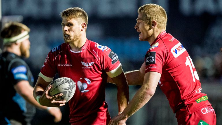 Tom Williams is congratulated after scoring Scarlets' first try