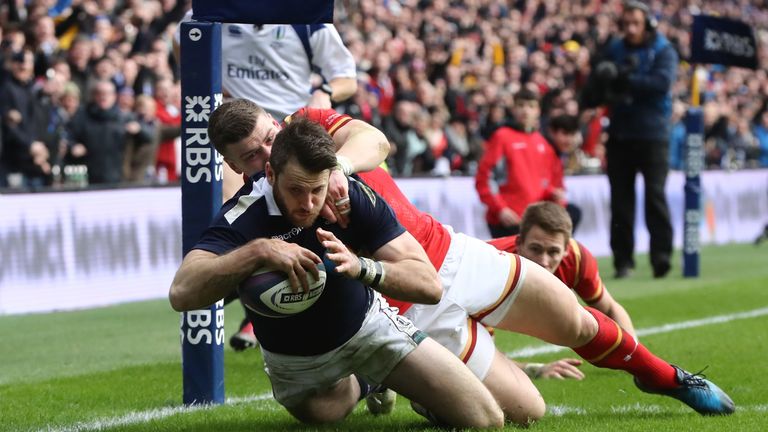 Tommy Seymour goes past Scott Williams of Wales to score a try