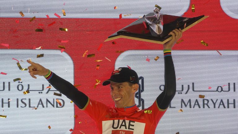 Portugal's Rui Costa, wearing the overall leader red jersey, celebrates on stage after winning the final Yas Island stage of the Tour of Abu Dhabi, on Febr