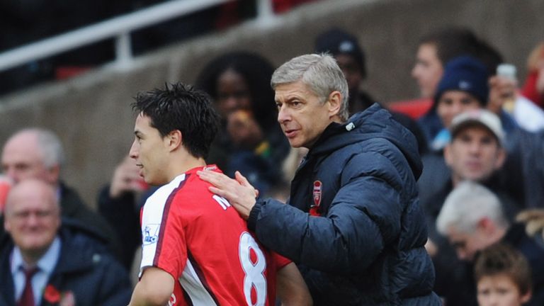 LONDON - NOVEMBER 08:  Samir Nasri of Arsenal (L) is congratulated by manager Arsene Wenger as he scores their second goal during the Barclays Premier Leag