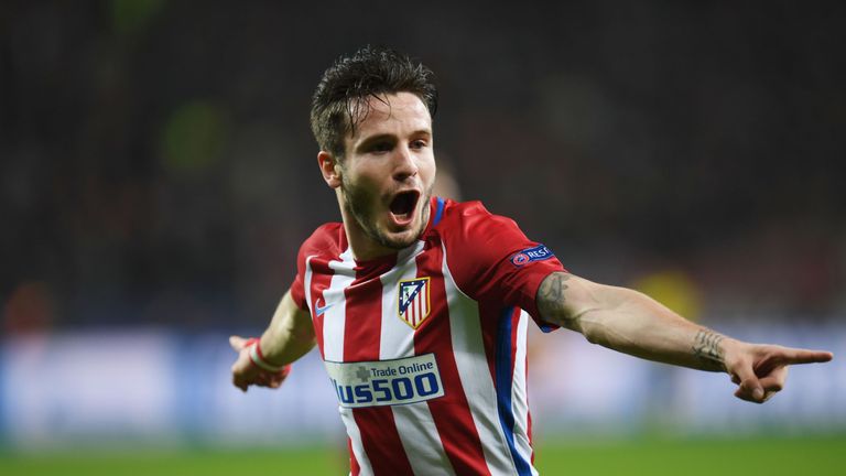 Atletico Madrid's midfielder Saul Niguez celebrates scoring the opening goal during the UEFA Champions League round of 16 first-leg football match between 