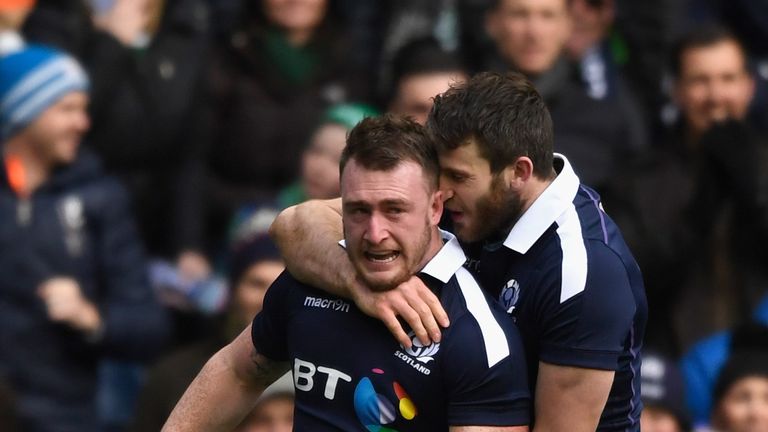EDINBURGH, SCOTLAND - FEBRUARY 04: Scotland Try scorer Stuart Hogg (l) celebrates after scoring the first try the RBS Six Nations match between Scotland an