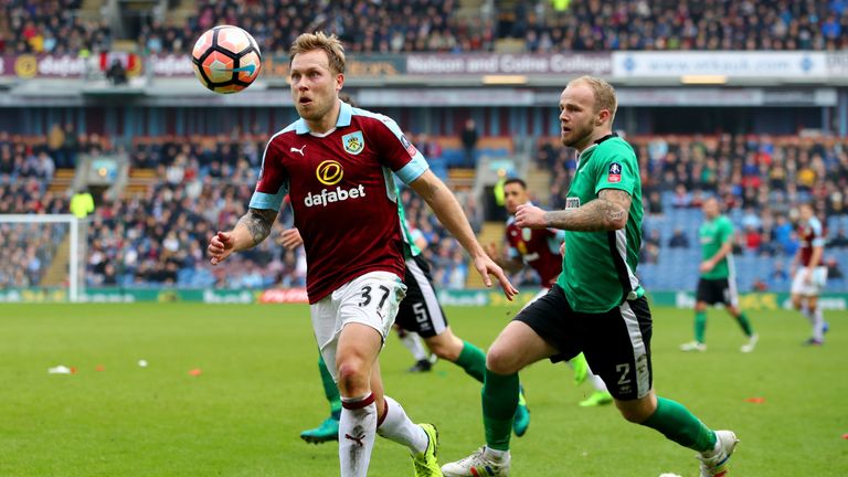 BURNLEY, ENGLAND - FEBRUARY 18: Scott Arfield of Burnley (L) is put under pressure from Bradley Wood of Lincoln City (R) during The Emirates FA Cup Fifth R