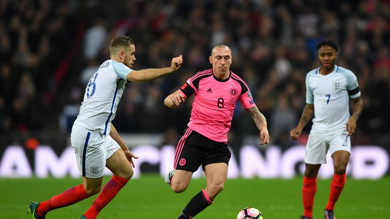LONDON, ENGLAND - NOVEMBER 11:  Scott Brown of Scotland takes on Jordan Henderson of England during the FIFA 2018 World Cup qualifying match between Englan
