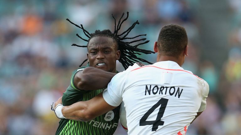 SYDNEY, AUSTRALIA - FEBRUARY 05:  Seabelo Senatla of South Africa is tackled by Dan Norton of England during the Cup Final match between England and South 