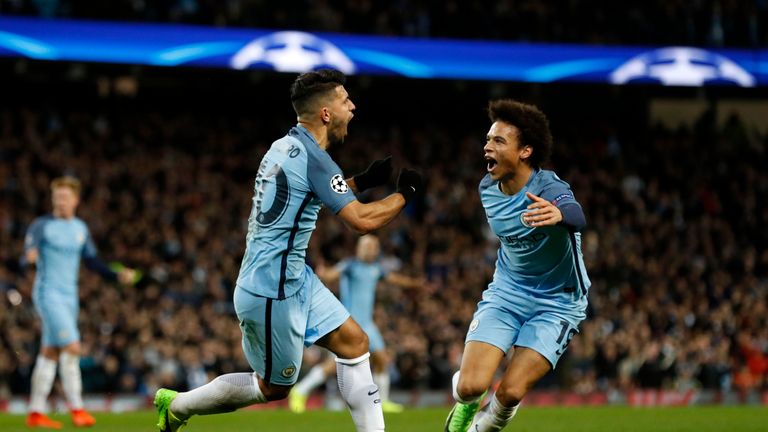 Manchester City's Sergio Aguero celebrates scoring his side's third goal with Leroy Sane