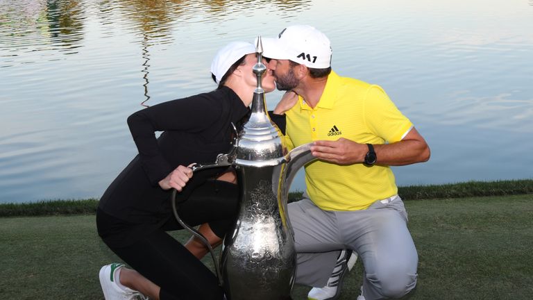 DUBAI, UNITED ARAB EMIRATES - FEBRUARY 05:  Sergio Garcia of Spain kisses his girlfriend Angela Akins following his victory during the final round of the O