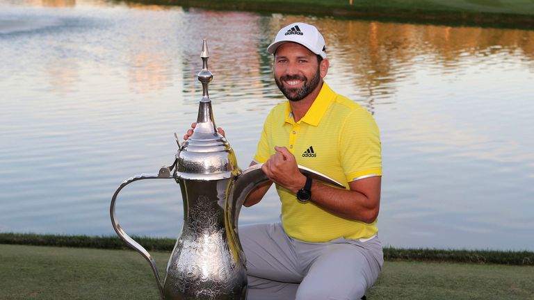 Sergio Garcia of Spain poses with the trophy after he won the Dubai Desert Classic golf tournament in Dubai, United Arab Emirates, Sunday, Feb. 5, 2017.