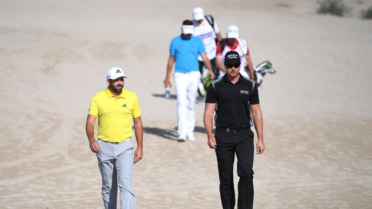 DUBAI, UNITED ARAB EMIRATES - FEBRUARY 05:  Sergio Garcia of Spain walks with Henrik Stenson of Sweden on the 14th hole during the final round of the Omega
