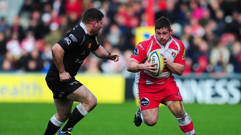 GLOUCESTER, ENGLAND - MARCH 22:  Shaun Knight of Gloucester runs at Rob Vickers of Newcastle Falcons during the Aviva Premiership match between Gloucester 