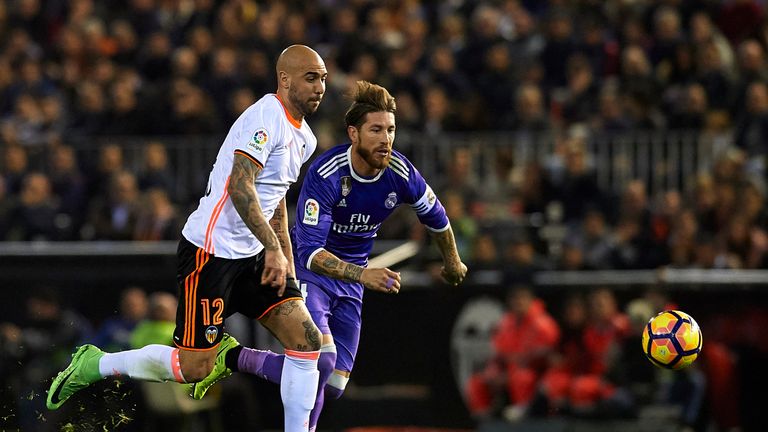 VALENCIA, SPAIN - FEBRUARY 22:  Simone Zaza (L) of Valencia competes for the ball with Sergio Ramos of Real Madrid during the La Liga match between Valenci