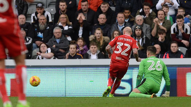 Bristol City's David Cotterill beats Newcastle United goalkeeper Karl Darlow to score his side's second goal during the Sky Bet Championship match at St Ja