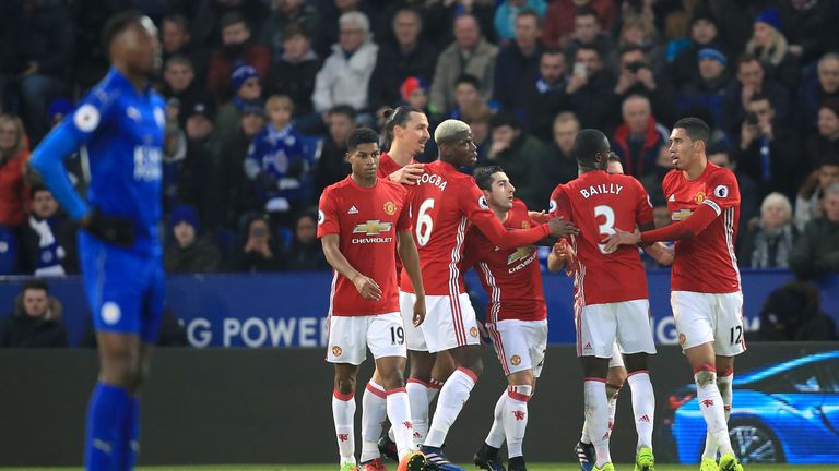 Manchester United's Henrikh Mkhitaryan (centre) celebrates scoring his side's first goal of the game during the Premier League match at Leicester