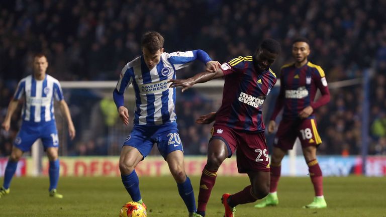 Solly March tries to keep the ball away from Josh Emmanuel 