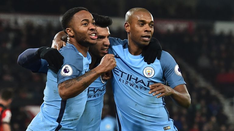 Manchester City's Argentinian striker Sergio Aguero (C) celebrates with Manchester City's English midfielder Raheem Sterling and Manchester City's Brazilia