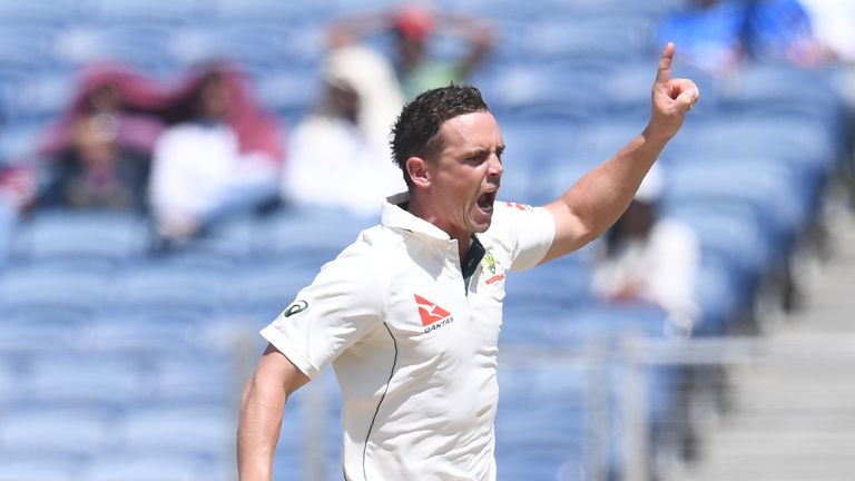 Australia's Steve O'Keefe celebrates after the dismissal of India's captain Virat Kohli on the third day of the first cricket Test match between India and 