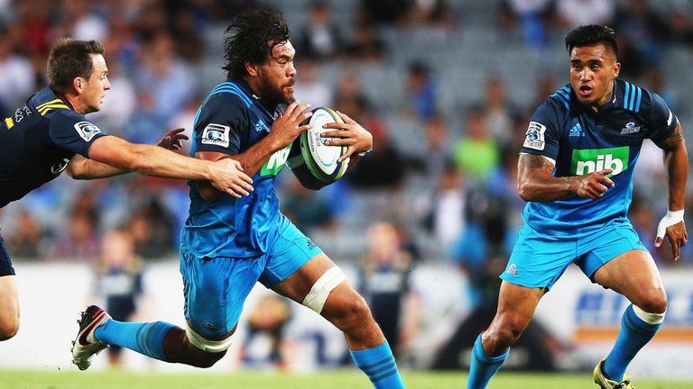 Auckland Blues loose forward Steven Luatua running with the ball