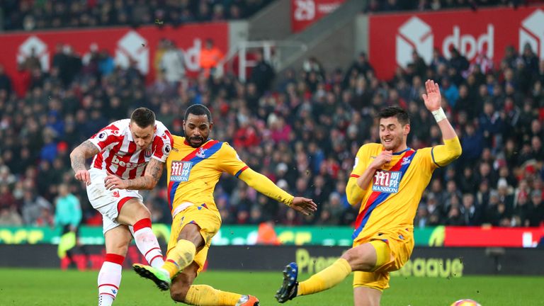 STOKE ON TRENT, ENGLAND - FEBRUARY 11:  Marko Arnautovic (L) of Stoke City shoots at goal while Jason Puncheon (C) and James Tomkins (R) of Crystal Palace 