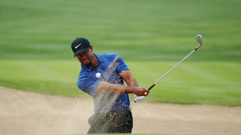 DUBAI, UNITED ARAB EMIRATES - FEBRUARY 02:  Tiger Woods of the United States plays from a bunker on the 6th hole during the first round of the Omega Dubai 