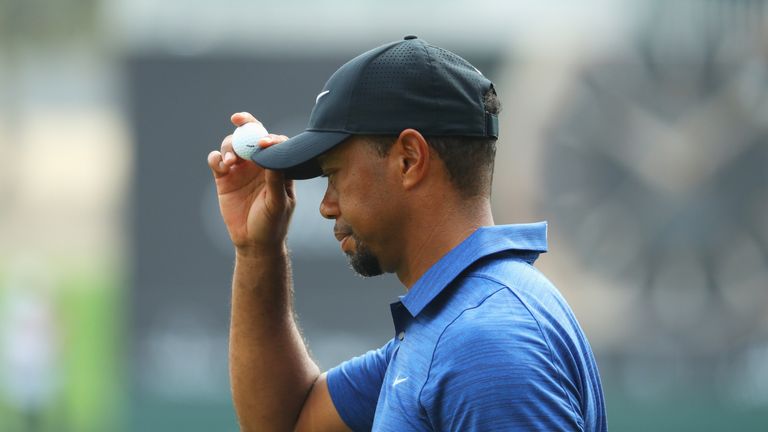 DUBAI, UNITED ARAB EMIRATES - FEBRUARY 02:  Tiger Woods of the United States acknowledges the crowd on the 9th green during the first round of the Omega Du
