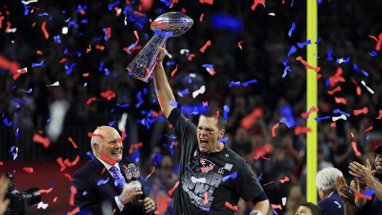 HOUSTON, TX - FEBRUARY 05:  Tom Brady #12 of the New England Patriots holds the Vince Lombardi Trophy after defeating the Atlanta Falcons 34-28 during Supe