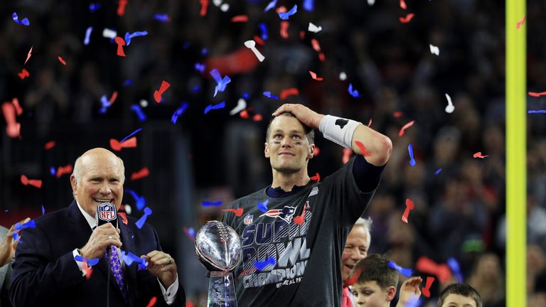 HOUSTON, TX - FEBRUARY 05:  Tom Brady #12 of the New England Patriots holds the Vince Lombardi Trophy after defeating the Atlanta Falcons 34-28 in overtime