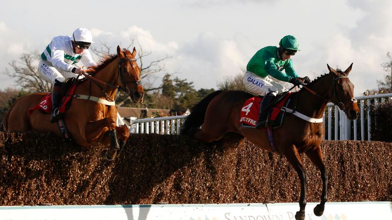 Top Notch ridden by Daryl Jacob leads Baron Alco over the last fence before going on to win the Betfred TV Scilly Isles Novices' Chase at Sandown