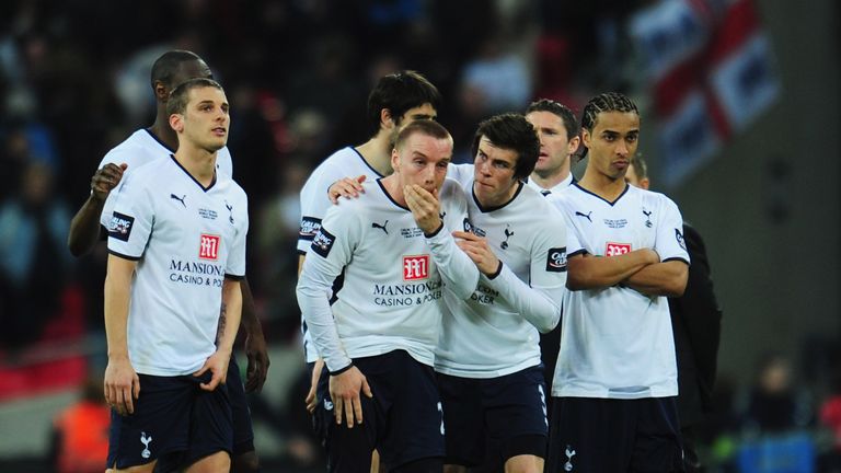 LONDON - MARCH 01:  A dejected Jamie O'Hara of Tottenham Hotspur (C) is consoled by team mates as they are defeated in the shoot out during the Carling Cup