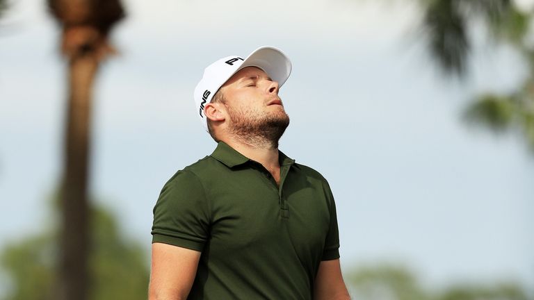 PALM BEACH GARDENS, FL - FEBRUARY 26:  Tyrrell Hatton of England reacts on the eighth green during the final round of The Honda Classic at PGA National Res