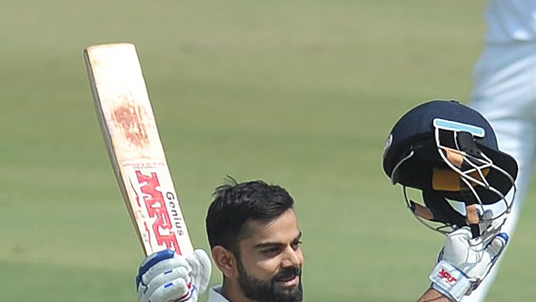 India's captain Virat Kohli raise his bat after scoring double century(200 runs) plays a shot on the second day of the only Test match between India and Ba
