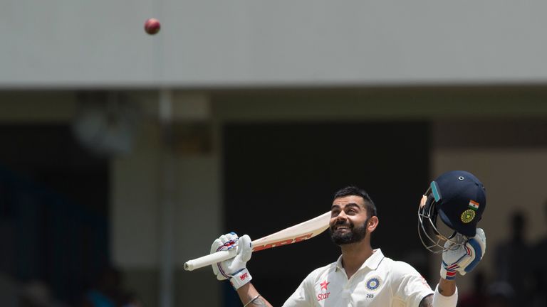 India cricketer Virat Kohli celebrates after batting 200 runs during day two of the cricket test match between West Indies and India July 22, 2016 at Sir V