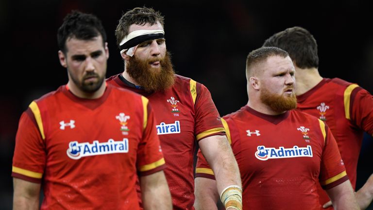 Dejected Wales players including Jake Ball (2nd left) leave the field after the RBS Six Nations match between Wales and England 11/02/2017