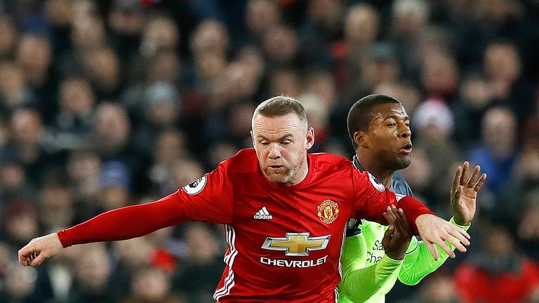 Wayne Rooney and Georginio Wijnaldum battle for the ball during the Premier League match at Old Trafford